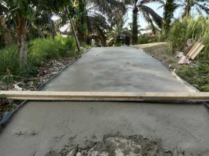 Pemdes Keritang Semenisasi Jalan Menuju Makam Dusun Masad
